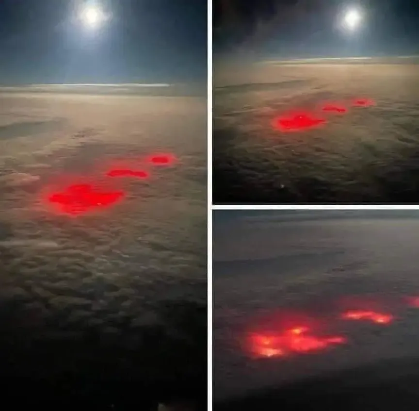 červená záře prosvítá skrz mraky